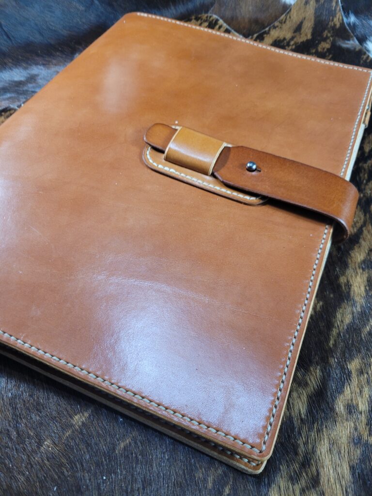 Large ereader case with strap closure.